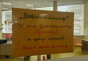 Plakat informujący o akcji Tydzień Bibliotek.